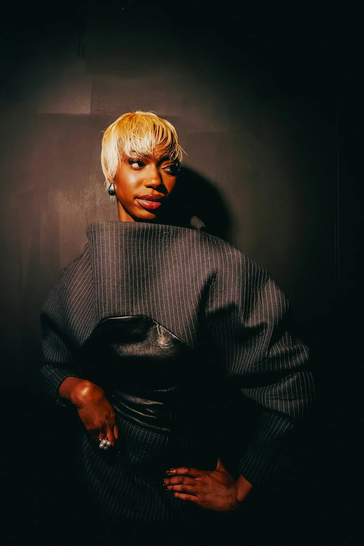 Editorial studio portrait representing a modern creator